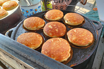 Close up shot of making Kamir. Kamir basically is a bread that almost similar to pancake from Pemalang, Central Java, Indonesia. Famous since 1970, Kamir usually served as a snack with tea or coffee.
