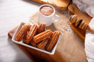 Churros. Fried wheat flour dough, a very popular sweet snack in Spain, Mexico and other countries where it is customary to eat them for breakfast or snack accompanied by hot chocolate or coffee.