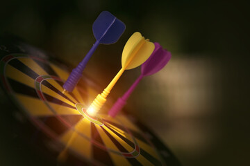 Bullseye target goal or dartboard has dart arrow throw hitting center shooting for financial...