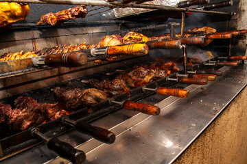 Brazilian style beef ribs Barbecue grill on skewers  at a churrascaria steakhouse in Brazil.