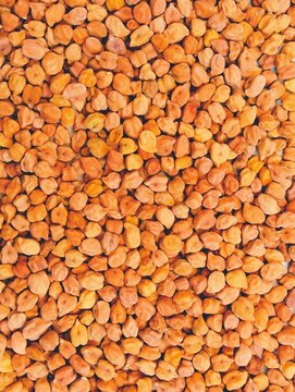 Brown chickpeas dried whole black chick pea kala chana organic food red desi indian bengal grams garbanzo beans egyptian peas lentils texture patren background design photo 
