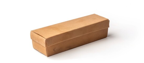 A brown cardboard box is placed on top of a clean white surface. The box appears to be sturdy and durable, with visible creases and flaps. It sits upright, casting a slight shadow underneath.