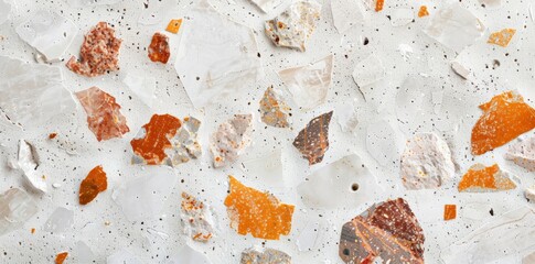 Detailed view of a rock wall featuring a variety of orange and white rocks in close proximity, showcasing the natural textures and colors of the stones.