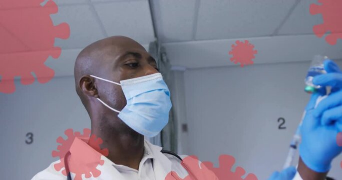 Animation of virus cells over african american male doctor preparing vaccine - Powered by Adobe
