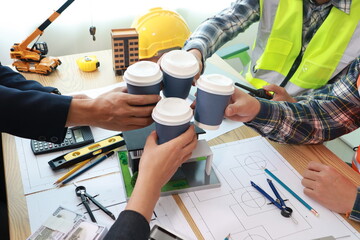 Engineer Team Meeting at Desk: Construction Cost Planning Hands Close-Up