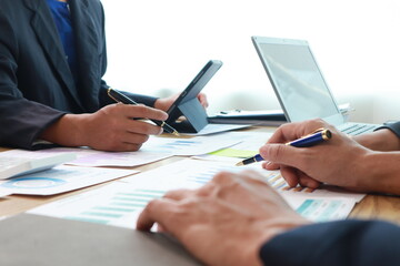 Close-Up Hand Business People Meeting Agenda at Desk, Stock Trends
