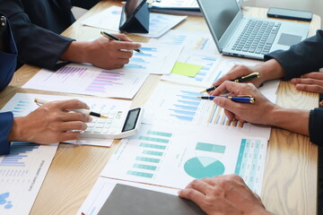 Close-Up Hand Business People Meeting Agenda at Desk, Stock Trends