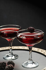 cocktail with juice decorated with blackberries
