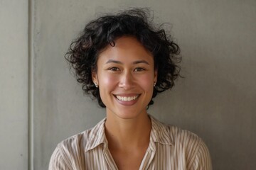 Fototapeta premium Cheerful young multiracial woman smiling and looking at camera. Generative AI