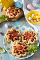 Pizza in puff pastry with cheese and tomatoes.