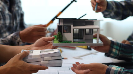 Closeup of hands engineer and architect team discussed about construction and architectural...