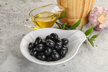 Black olives with oil and branch
