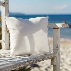 design mockup white blank square pillow on a bench with beach in the background for your print business