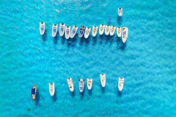 Vacation and leisure. Aerial view on fast boats on blue Mediterranean sea at sunny day. Fast ships on the sea surface. Seascape from the drone. Seascape from air. Seascape with motorboat. - 749249997