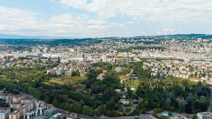 Fototapeta na wymiar Lausanne, Switzerland. Panorama of the city and view of the Bois de Vaux Cemetery. Located on the shores of Lake Geneva. Summer day, Aerial View