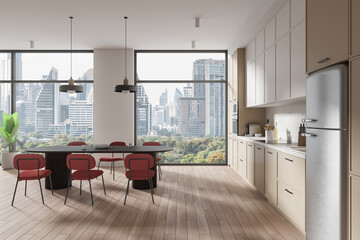 Beige home kitchen interior with cooking cabinet and eating table, window