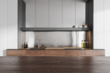 Wooden mock up countertop on background of kitchen interior with kitchenware
