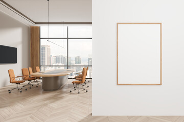 Cozy office interior with meeting table and tv screen, window and mockup frame