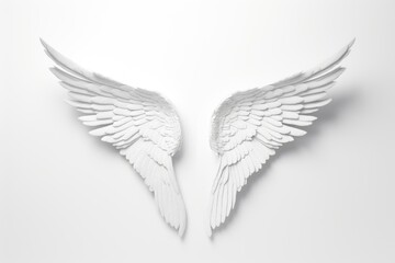 Naklejka premium Angelic White Wings Isolated. Sculptural white plaster wings on a pure white background, conveying a sense of peace and angelic grace.