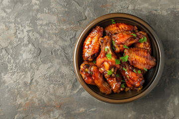 bowl of chicken hot wings  in editorial food photography style on concrete rustic background with copy text space