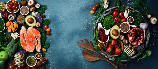 Healthy food background. Concept of Healthy Food, Fresh Vegetables, fish, Nuts and Fruits. On a concrete background. Top view. Copy space