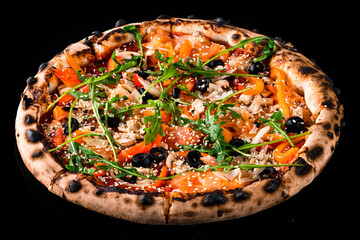Italian lunch pizza with mushrooms, olives, tomatoes, bell peppers, arugula, cheese, onions and sesame seeds isolated on black.