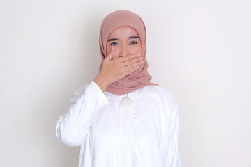 Fototapeta premium Moslem Asian woman covering her mouth because of bad breath