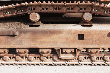 Fototapeta na wymiar Close-up of metal tracks of a crawler crane. Chassis tracked vehicles.