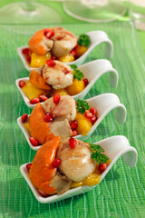 Sautéed scallops with mango and pomegranate,