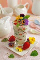 Kefir with fruits and flowers.
