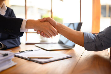 Cropped shot of businesspeople shaking hands after meeting or successful negotiations