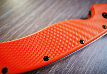 Orange handle of hand knife object backdrop