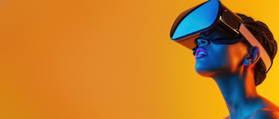 An amazed woman tilts her head upwards while wearing a VR headset on an orange background, illustrating amazement in technology - obrazy, fototapety, plakaty