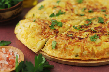 Frittata, traditional egg and potato omelette, Italian dish
