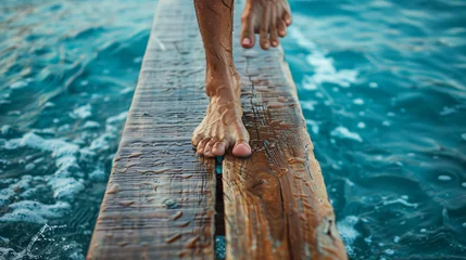 Deurstickers walking barefoot on the pier © UsamaR