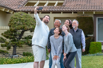 Six Multigeneration, Multicultural Family Members Taking Smiling Selfie Outside in Afternoon Front Yard, California, USA, horizontal
