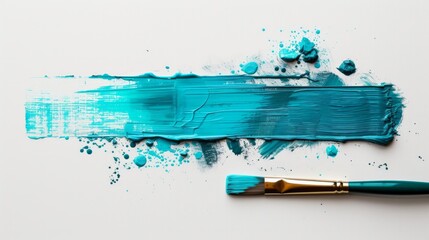 Paintbrush with dripping aqua blue paint isolated over white background.
