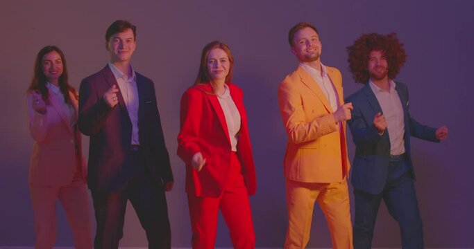 Vibrant and diverse group of people in colorful costumes dance together under neon flash lights. Dancer dancing. The atmosphere is festive, with the disco music adding to the joy of the happy crowd.
