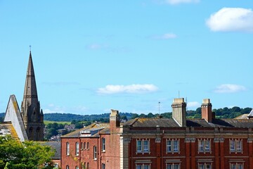 City buildings and church spire rear seen from Rougemont Gardens, Exeter, Devon, UK, Europe. - 749303165