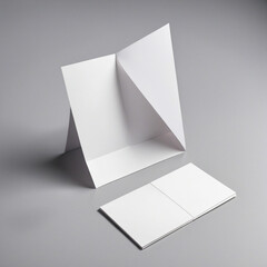 Blank folded flyer, booklet, postcard, business card or brochure on grey