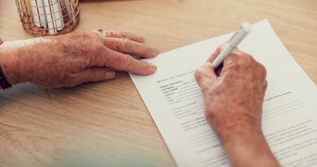 Hands, medical or person with contract to sign on application or documents for life insurance. Pov...