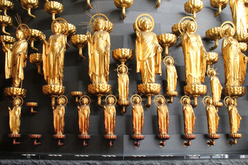 golden statues in a temple in osaka in japan 