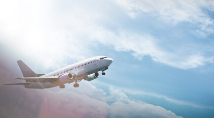 Airplane, transportation and flight with sky for travel with journey, lens flare and flying in air...