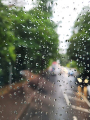 raindrops on a windscreen, selective focus, background of drops on a bus window glass