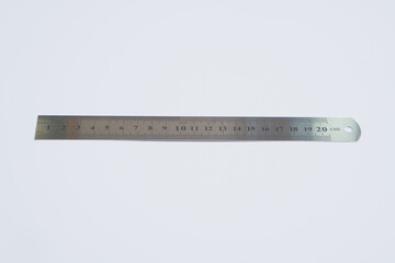 an iron ruler 20 centimeters long on a white background     