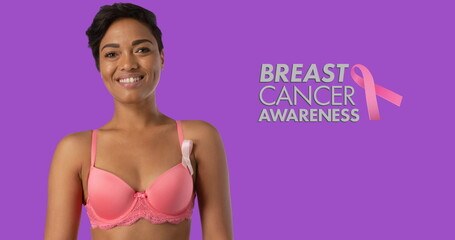 Image of breast cancer awareness text over smiling african american woman on purple background