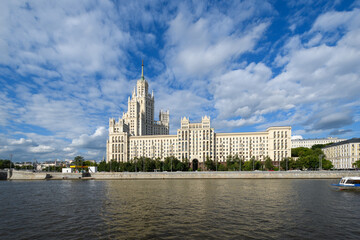 Fototapeta na wymiar View of the Kotelnicheskaya embankment of the Moscow River. Characteristic architectural structures of the Stalinist Empire style surrounded by later Soviet style and modern solutions.