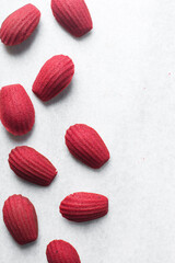 Top view of Red velvet madeleines on a marble tray, red madeleines cake or cookies for bakery