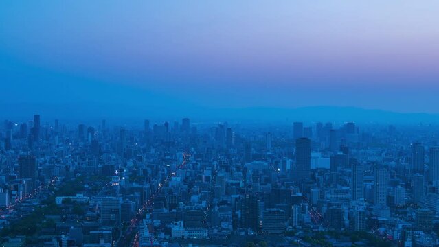 大阪市街地の夜から朝の美しい朝焼けタイムラプス【ズームアウト】