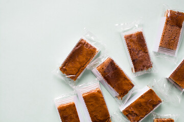 Cakes individually wrapped in plastic packaging, unsustainable product packaging, mini cakes in plastic wrappers wasteful and bad for the environment